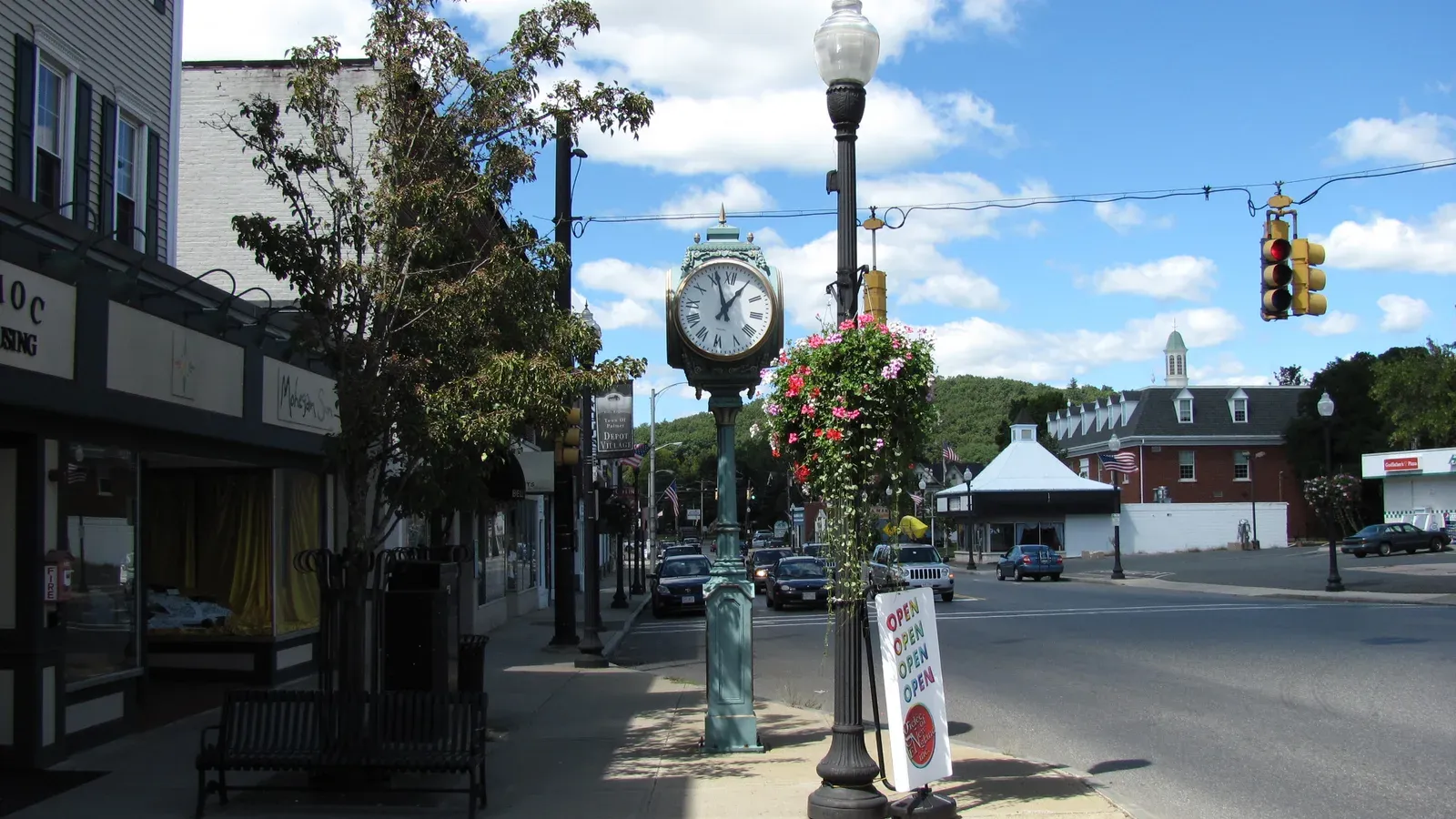 Downtown Main Street with the ornamental town clock and brick storefronts of Depot Village, Palmer, Massachusetts